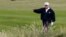 U.S. President Donald Trump walks on the course of his golf resort in Scotland.