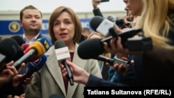 After casting her ballot on October 20, President Maia Sandu said by voting today Moldovans "can preserve peace and stability" in the tiny country, adding, "Moldovans must determine their own destiny" without "lies and dirty money."