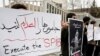 Demonstrators outside the British Embassy in Tehran on March 29