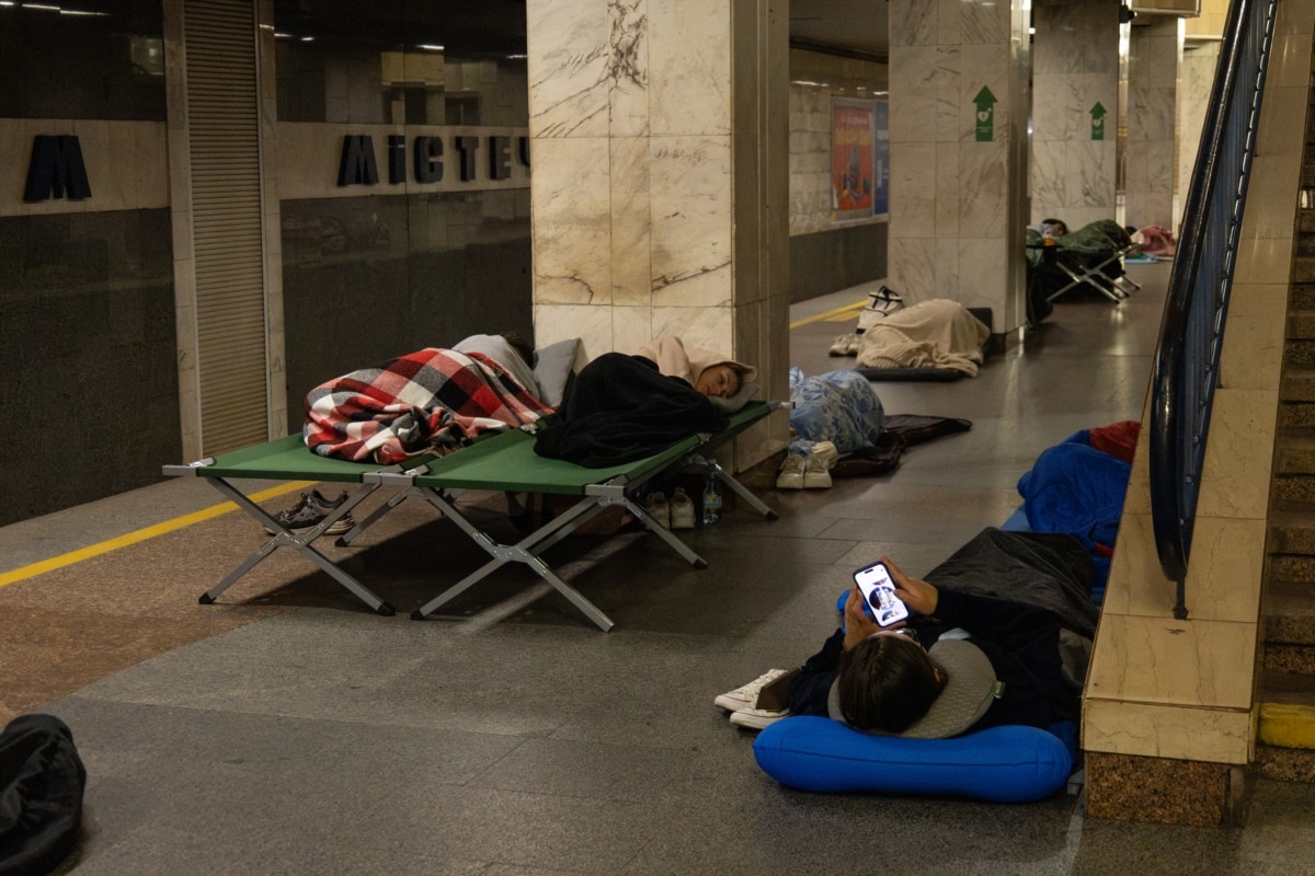 People spend the night in the subway during an air raid alert on August 10, 2026.