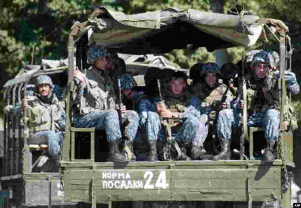 Special forces troops sit on a military trucks patrol the streets of Andijon four days after troops had opened fire on the crowd - The Andijon events have had wide-ranging impact on Uzbekistan's foreign relations. The European Union imposed political and economic sanctions on the Uzbek government. Relations between Tashkent and Washington also deteriorated after U.S. criticism of the Andijon killings. Uzbekistan ordered the closure of a U.S. military air base (Karshi-Khanabad) that performed a key support role for U.S. forces in Afghanistan. 