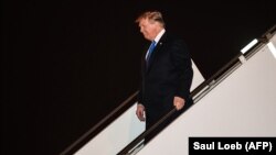 U.S. President Donald Trump disembarks from Air Force One at Noi Bai International Airport in Hanoi on February 26.