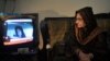 In Karachi, Ismat Siddiqui, the mother of Aafia Siddiqui, watches a news report following the court verdict against her daughter.
