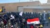 Iraq - Thousands of protesters surrounded the U.S. Embassy compound in Baghdad on December 31 in a protest over recent U.S. air strikes that killed at least 25 members of an Iran-backed militant group, Kataeb Hizbullah. AFP screen grab