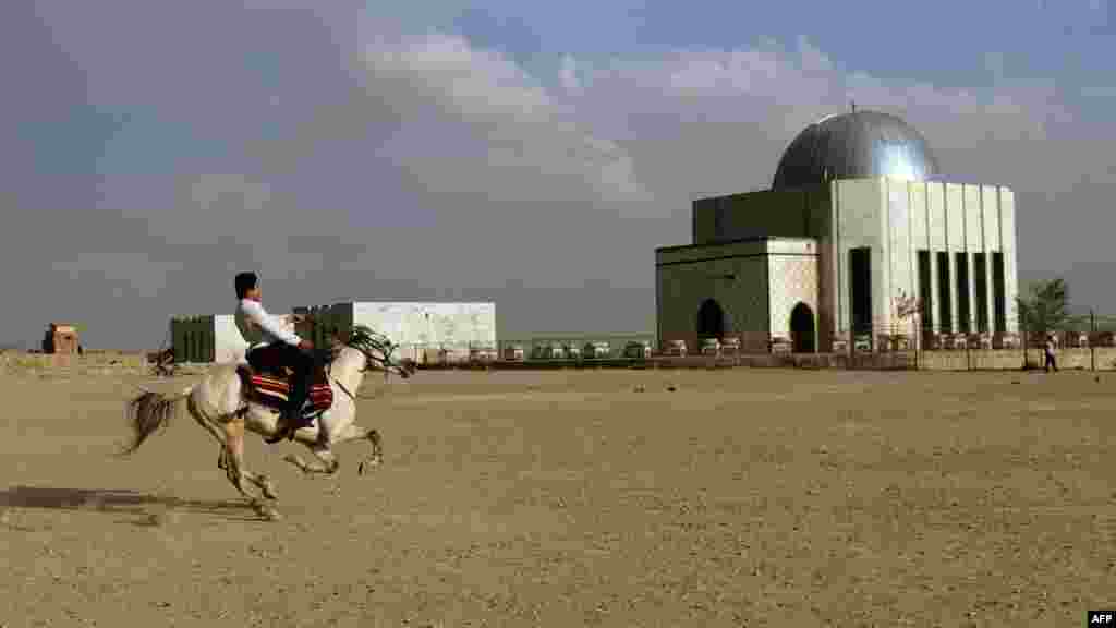 A man rides his horse near the tomb of Nadir Khan in Kabul, Afghanistan, on October 18. (AFP/Munir uz Zaman)