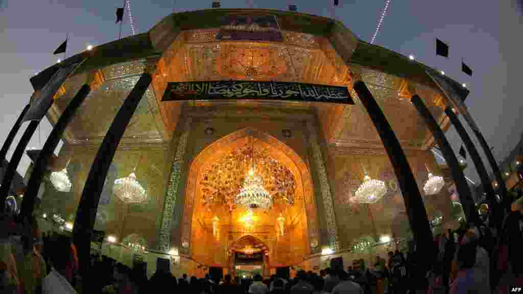 Shi'ite pilgrims gather at the shrine of Imam Musa al-Kadhim in northern Baghdad's Kadhimiyah neighborhood on June 14. (Ahmad al-Rubaye)