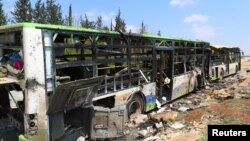 Алеппо түбіндегі жарылыстан бүлінген автобустар. Сирия, 15 сәуір 2017 жыл. 