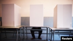 A man casts his vote at a polling booth in Potocari, near Srebrenica.