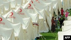 Turkey -- Homeless survivors of a major earthquake of 7.2 magnitude hit eastern province of Van take shelter at the Turkish Red Crescent tent camp in Ercis, 26Oct2011