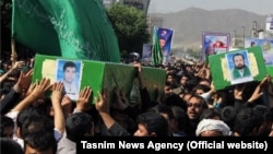 A funeral for four Afghan refugees who were killed in Syria was held in the Iranian city of Mashhad on May 15.