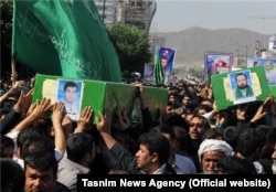 A funeral is held in the Iranian city of Mashhad for four Afghan refugees who were killed in action in Syria. (file photo)