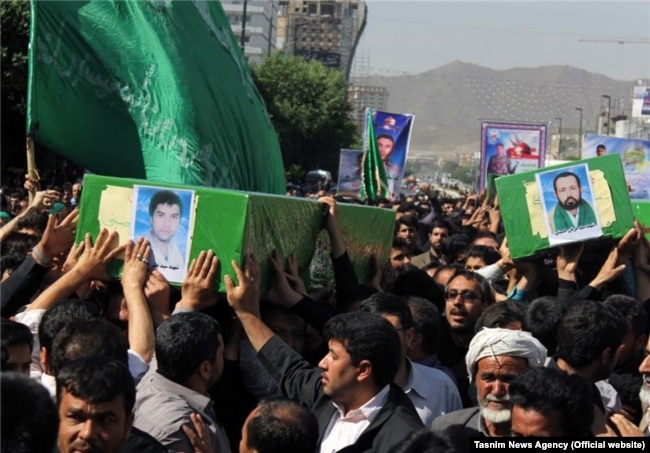A funeral is held in the Iranian city of Mashhad for four Afghan refugees who were killed in action in Syria. (file photo)