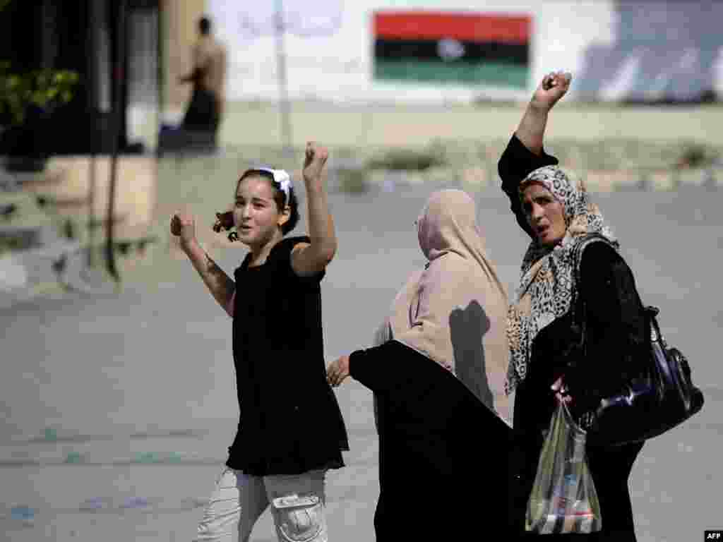 Libyan women in Tripoli cheer on the rebels.