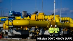 Employees walk at the construction site of a gas metering station, part of the pipeline link between Bulgaria and Greece near the village of the Malko Kadievo, on March 18.