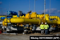 Employees walk through the construction site of a gas metering station, part of the planned pipeline link between Bulgaria and Greece near the village of the Malko Kadievo, in March.