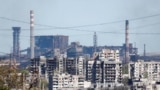 Azovstal Iron and Steel Works behind damaged residential buildings