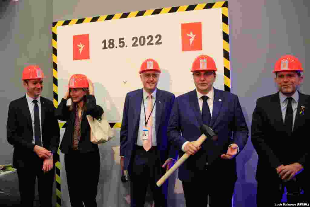 CZECH REPUBLIC -- the ground-breaking event -- Symbolic launch of project (breaking of fake wall, sledge hammers, hard hats) -- Czech FM Jan Lipavsky attends, Prague May 18, 2022