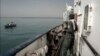 A Revolutionary Guard patrols the deck of a ship in the Persian Gulf. (illustrative photo)