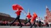 Russian children march under a flag featuring the communist hammer and sickle on Moscow&rsquo;s Red Square on May 22.<br />
<br />
Some 5,000 schoolchildren became &ldquo;All-Russian Pioneers&rdquo; during a ceremony organized by the country&#39;s Communist Party on May 22, replete with symbology from Russia&rsquo;s socialist past.