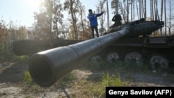 A Spanish tourist films for his YouTube channel during a war tour in the Kyiv region in November 2024.