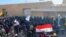 Iraq - Thousands of protesters surrounded the U.S. Embassy compound in Baghdad on December 31 in a protest over recent U.S. air strikes that killed at least 25 members of an Iran-backed militant group, Kataeb Hizbullah. AFP screen grab