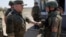 Иллюстративное фото. Министр обороны России Сергей Шойгу (слева) и солдаты российской армии.