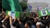 A funeral is held in the Iranian city of Mashhad for four Afghan refugees who were killed in action in Syria. (file photo)