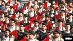 Basij militiamen march in Tehran.