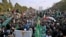 Supporters of the Pakistan Democratic Movement, an alliance of opposition parties, protest outside the head office of the Election Commission of Pakistan in Islamabad on January 19.