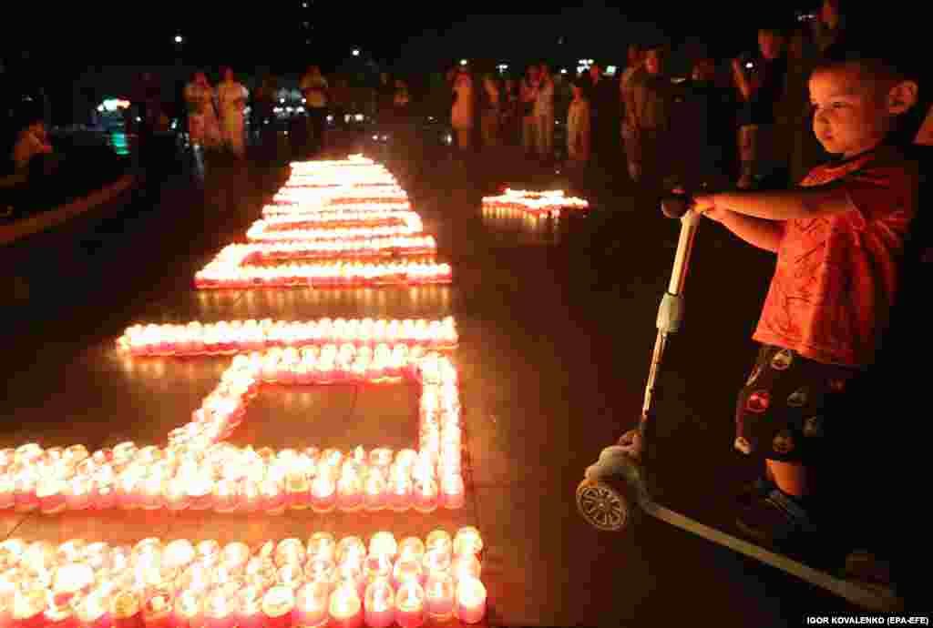 Candles spell out the words &quot;We Remember&quot; at a ceremony marking the eve of the anniversary of the Soviet Union&#39;s involvement in World War II in 1941 in Bishkek on June 21.