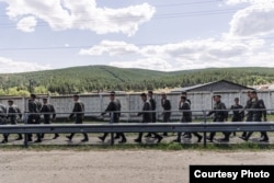 A unit of Russian soldiers walk through Buryatia on June 29.