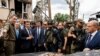 Italian Prime Minister Mario Draghi (second left), French President Emmanuel Macron (third left), and German Chancellor Olaf Scholz (right) visit Irpin on June 16.