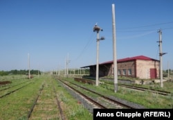 A stork watches over the unused Akhuryan train station. The tracks on the left run straight toward the nearby border with Turkey.