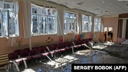 A damaged school is seen after Russian missile strikes in a residential area of Kharkiv on June 27.