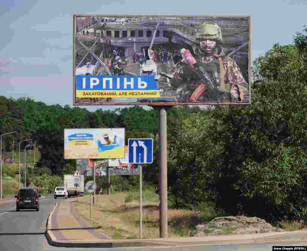 &quot;Irpin: Tortured But Not Broken&quot; -- in Irpin.&nbsp; The affluent city, located just northwest of Kyiv suffered widespread destruction during its occupation by Russian forces. The bridge in the billboard was destroyed, apparently by Ukrainian forces, to halt the Russian advance.