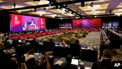 Indonesia's Foreign Minister Retno Marsudi is seen on the screen during the G20 foreign ministers' meeting in Bali on July 8.