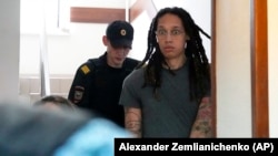 Brittney Griner is escorted to a courtroom for a hearing in Khimki just outside Moscow on June 27.