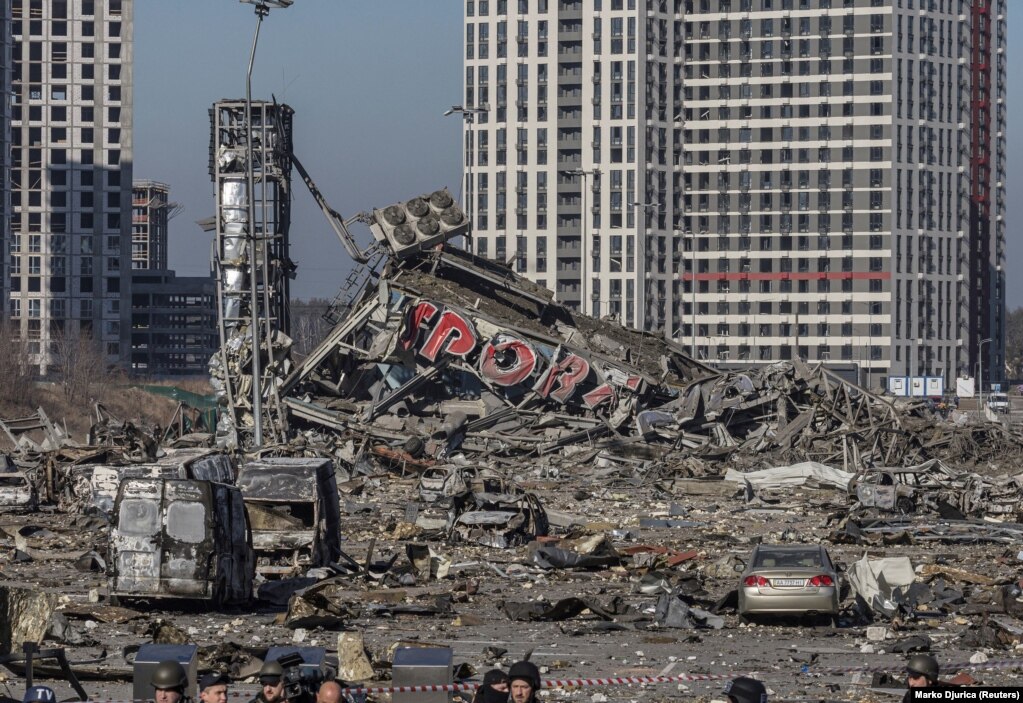 The scene of an apparent missile strike that destroyed a shopping center and killed eight people on March 20. The Kremlin claimed the area was being used by the Ukrainian military. A man was detained by the Ukrainian authorities for posting footage to TikTok showing military vehicles around the shopping center before the attack.