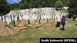 Coffins with the remains of 50 victims of the Srebrenica genocide who were recently identified were buried on July 11.