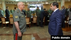 Armenia - General Kamo Kochunts (left), acting army chief of staff, greets Defense Minister Suren Papikian at the start of a meeting in Yerevan, June 28, 2022.