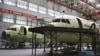 Самолеты ТУ-214 в ангаре самолетостроительного завода "КАПО им. С. П. Горбунова"