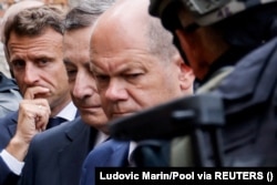 Президент Франции Эмманюэль Макрон, премьер-министр Италии Марио Драги и канцлер Германии Олаф Шольц в городе Ирпень, 16 июня 2022 года