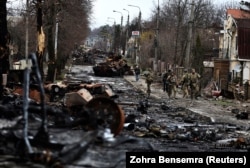 Destroyed armored vehicles on a street in Bucha, northwest of Kyiv, on April 2