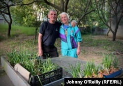 Hevryasova, pictured with Hevryasov, says before the war the neighbors weren't particularly friendly with one another. "Now we're like family," she says.