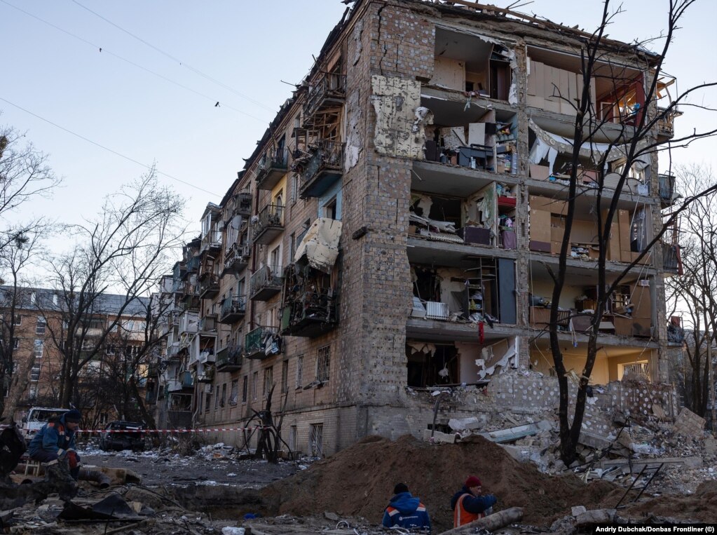 An apartment building that had some of its outer walls blasted off after an explosion from an apparent missile strike in a Kyiv suburb on March 18.