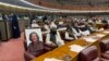 A fellow member of Pakistan's National Assembly put a photo of Ali Wazir on his chair in protest in March 2022.