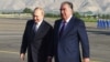 Tajik President Emomali Rahmon (right) greets his Russian counterpart, Vladimir Putin, in Dushanbe on June 28. 