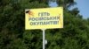 &quot;Russian Occupiers Out!&quot; -- on a highway near Dnipro.