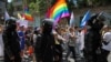 Police escort participants during the LGBT Pride march in Chisinau in June 2022. 