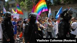 Police escort participants during the LGBT Pride march in Chisinau in June 2022. 